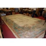 An extremely large Chinese superwash Kayam cream ground woollen rug,