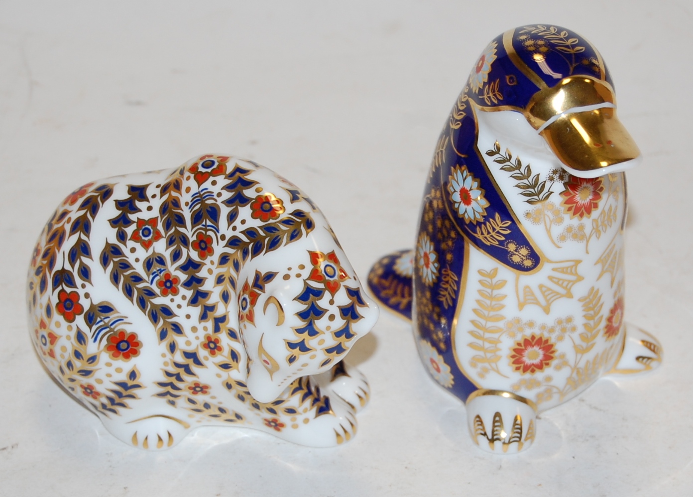 A Royal Crown Derby desk ornament in the form of a duck-billed platypus,