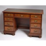 A Victorian walnut and figured walnut twin pedestal desk,