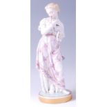 A circa 1900 Meissen Dresden porcelain figurine, of a maiden cradling a dove,