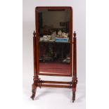 A Victorian flame mahogany cheval mirror, the rectangular plate within turned supports,