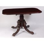 A Regency mahogany pedestal breakfast table, having rectangular tilt-top to a reeded column,