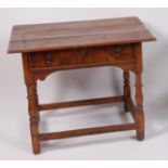 An early 19th century joined elm single drawer side table,