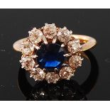 An 18ct gold, sapphire and diamond cluster ring,