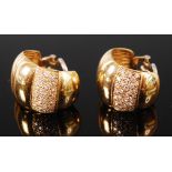 A pair of 18ct gold and diamond set ear clips, modelled as scallop shells,