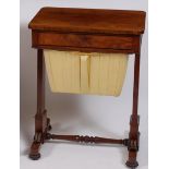 A William IV rosewood needlework table, having single frieze drawer over a pleated silk-lined well,