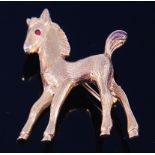 A modern 9ct gold brooch, modelled as a standing fawn, having small ruby set eye, 5.4g, 3.