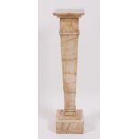 *A 1920s onyx sculpture stand, having square revolving top to a knopped and tapering column, h.