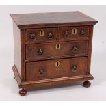 A walnut and figured walnut collectors chest, in the early 18th century style,