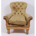 A George IV giltwood framed spoonback library armchair, in the manner of George Smith & John Loudon,
