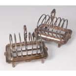 A pair of Mappin & Webb silver six division toast racks, each having acanthus leaf cast handles,
