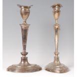A pair of silver table candlesticks in the Adam style,