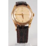 An Omega 9ct gold cased gents dress watch, having signed champagne dial (badly tarnished),