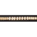 A modern yellow metal and diamond set sectional bracelet, unmarked but tests as approx 17ct,