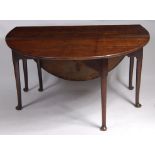 *A George III oak padfoot table, the oval fall leaves on turned and tapering gatelegs, w.138cm, d.