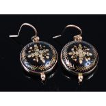 A pair of 9ct gold backed pique worked ear pendants, each of circular form,