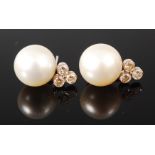 A pair of white gold, cultured pearl and diamond set ear studs, unmarked but test as 21ct gold,