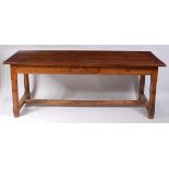 A 19th century French fruitwood plank top refectory table, having cleated ends,