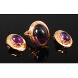 An 18ct gold and cabochon amethyst set dress ring, the large amethyst measuring approx 1.8 x 1.