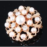 A 9ct gold, cultured pearl and diamond set flower head brooch,