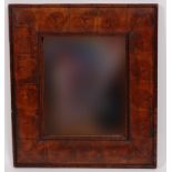 A William & Mary style oyster veneered cushion wall mirror,