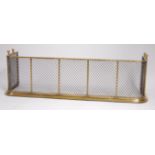 A Regency brass and wirework sparkguard, the top rail supported on spiral reeded supports, w.