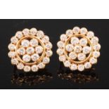 A pair of yellow metal and diamond cluster ear studs,
