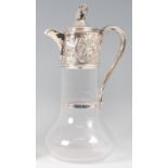 A mid-Victorian glass and silver topped claret jug,