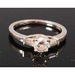 An 18ct white gold and diamond solitaire ring, the four claw set brilliant weighing approx 0.