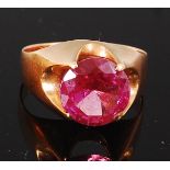 A modern 14ct yellow gold and pink ruby set dress ring, the ruby weighing approx 2.