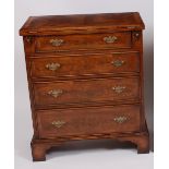 A walnut and figured walnut bachelors chest,