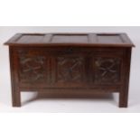 A circa 1700 joined oak three panel coffer, having loop hinges, fitted candle box,