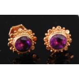 A pair of 9ct gold amethyst set ear studs, the round cut amethysts each weighing approx 0.6ct, dia.