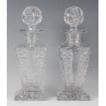 A pair of late Victorian heavy glass decanters and stoppers, each of square section,