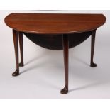 A George III Irish mahogany padfoot dining table, having oval fall leaves,