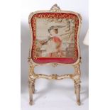 A mid-19th century French giltwood and gesso fire screen, having tapestry inset panel (with losses),