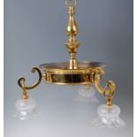 An early 20th century lacquered brass three light ceiling pendant,