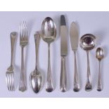 A George V silver part cutlery suite, comprising; five table forks, two tablespoons,