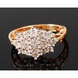 An 18ct gold diamond cluster ring, arranged as four claw set princess cut diamonds,