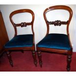 A set of eight Victorian mahogany balloon back dining chairs, each having drop-in seats,