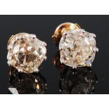 A pair of 18ct gold diamond ear studs, the claw set old cut diamonds weighing approx 2.5ct and 2.