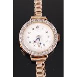 A ladies 18ct gold diamond set cocktail watch, having silvered dial with subsidiary seconds dial,