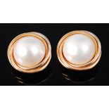 A pair of modern Mappin & Webb 18ct gold and pearl set ear clips,