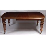 *A late Victorian mahogany extending dining table,