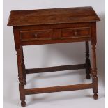 *An early 18th century joined oak single drawer side table,