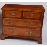 A burr walnut oak crossbanded and feather-banded bachelors chest, in the early 18th century style,