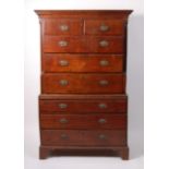 A George III oak chest-on-chest, the upper section having fluted quarter turned pilasters,