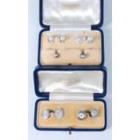 An 18ct white gold and cultured pearl set pair of gents cufflinks,