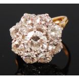 An 18ct gold diamond flower head cluster ring,