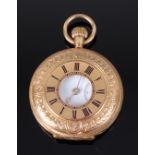 An 18ct gold cased ladies half hunter pocket watch, having finely engraved case,